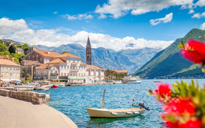 Historic town of Perast with church tower by Bay of Kotor, Montenegro in summer.