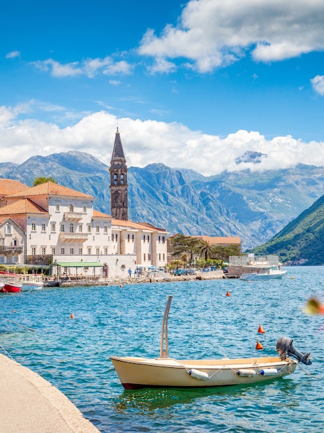 Historic town of Perast with church tower by Bay of Kotor, Montenegro in summer.