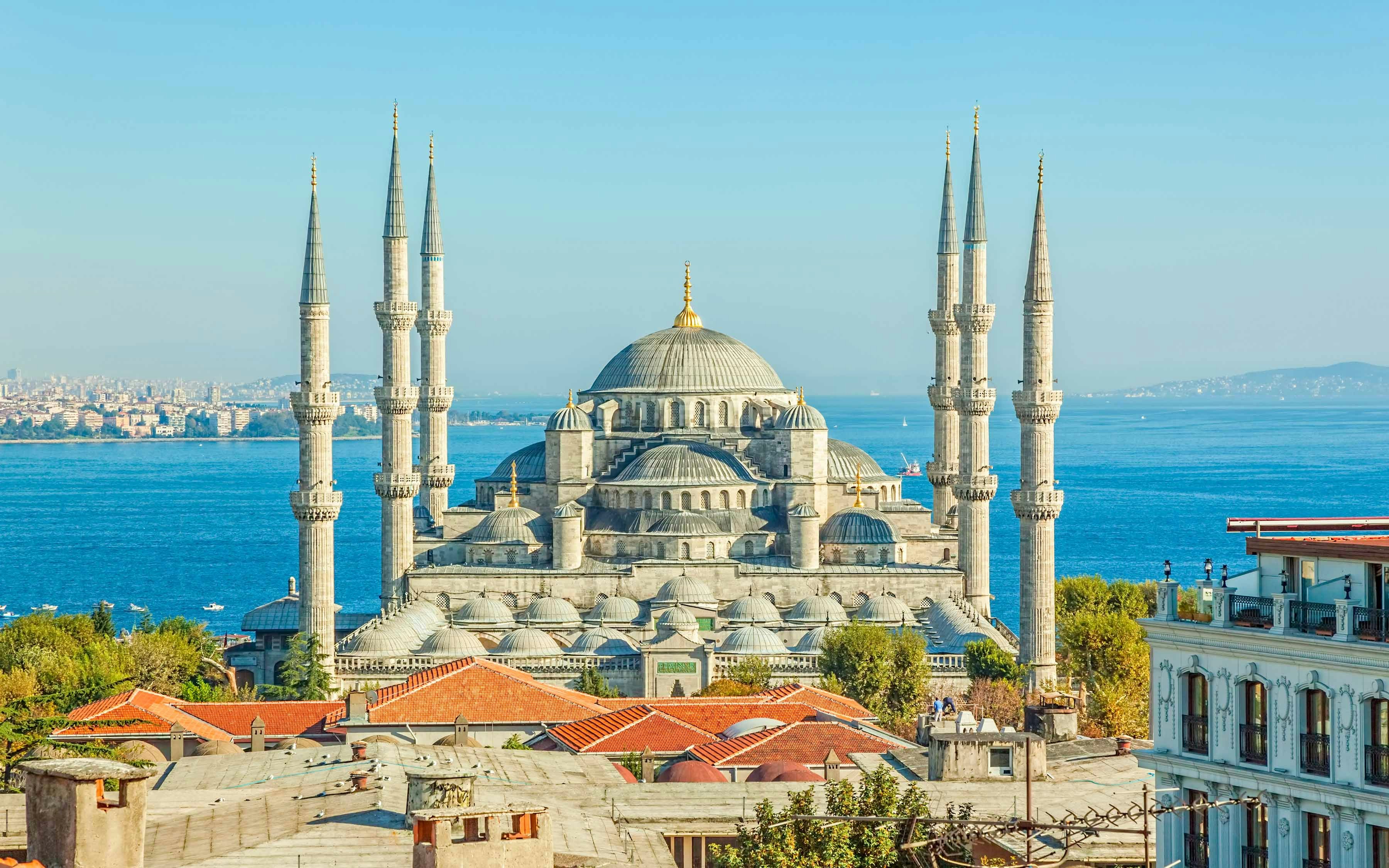 Blue Mosque exterior with domes and minarets in Istanbul, Turkey.