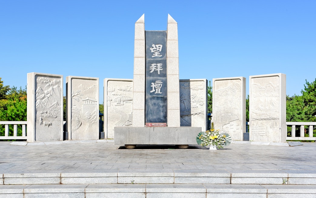 Mangbaedan Memorial Altar at DMZ, South Korea, with stone carvings and floral tribute.
