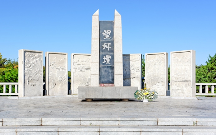Mangbaedan Memorial Altar at DMZ, South Korea, with stone carvings and floral tribute.
