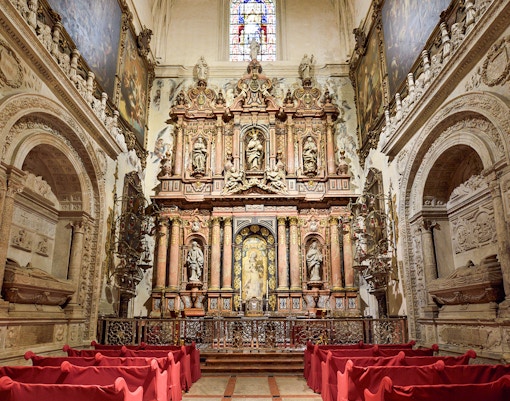 Seville Cathedral Royal Chapel interior with ornate altar and Gothic architecture.