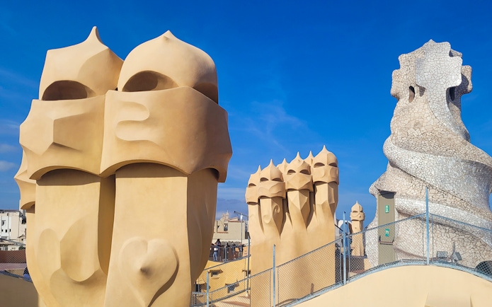 La Pedrera Casa Mila rooftop chimneys and sculptures in Barcelona.