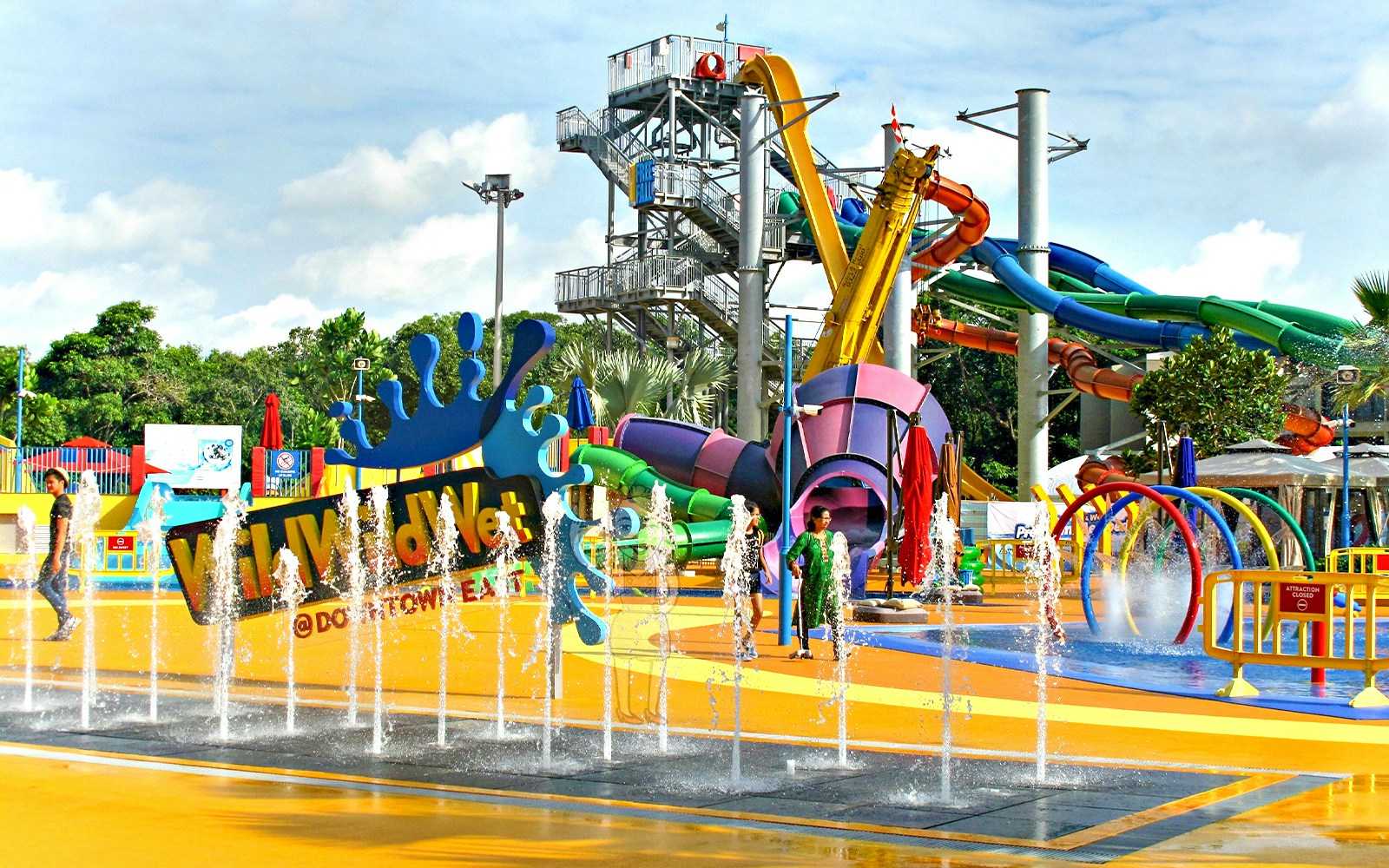 Wild Wild Wet water park entrance with colorful slides and splash fountains in Singapore.
