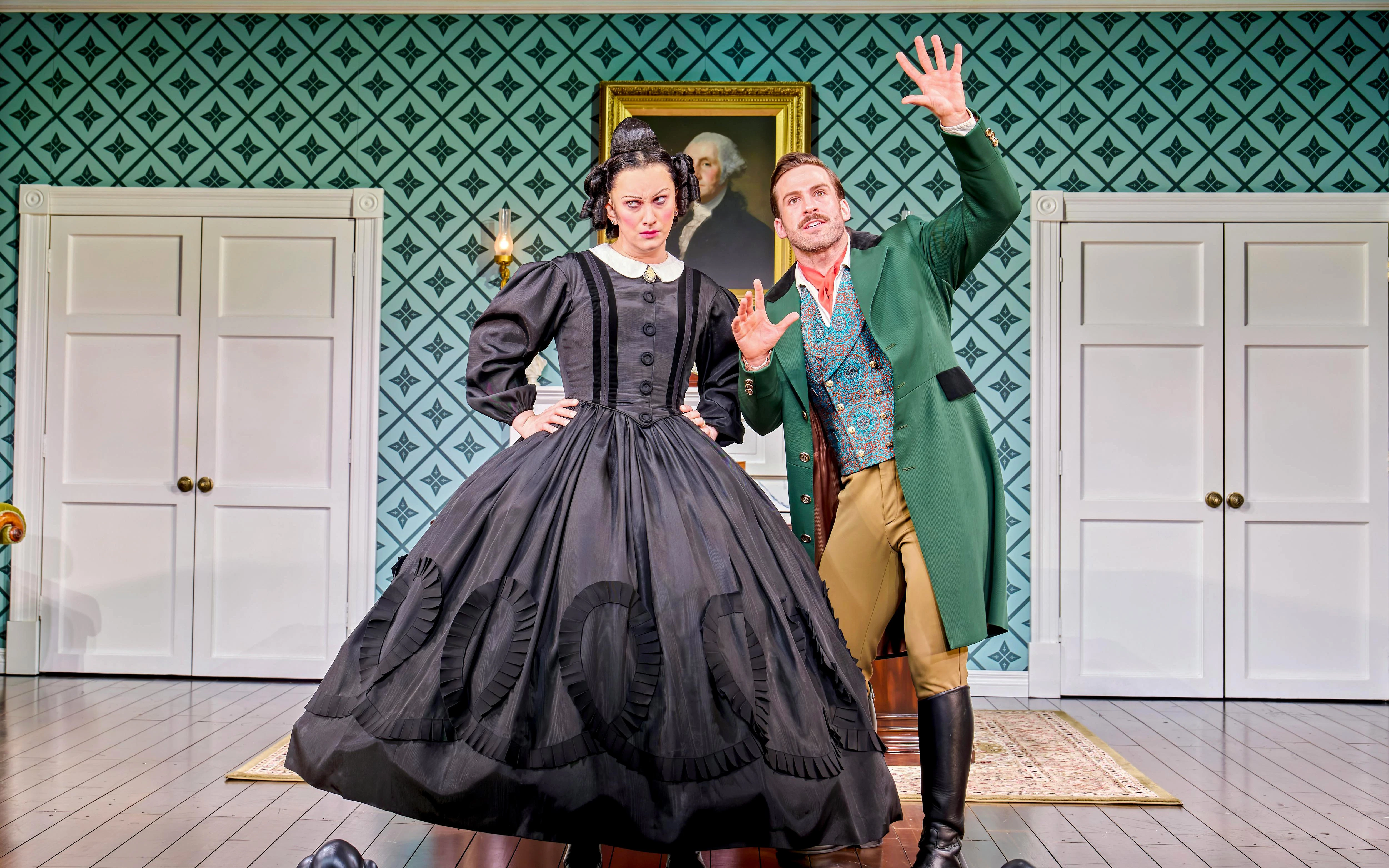 Actors in period costumes performing a scene from "Oh Mary!" in a vintage room setting.
