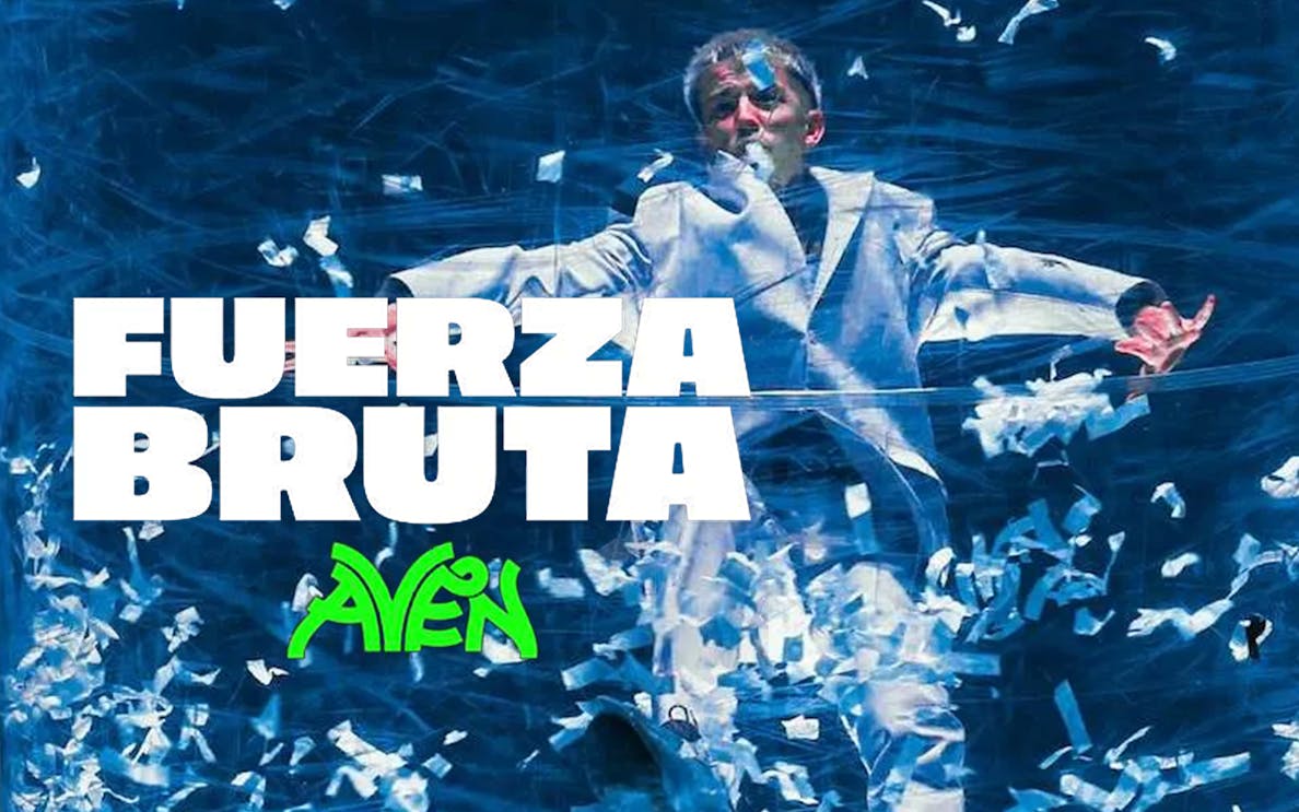 Performer in Fuerza Bruta: Aven show surrounded by blue and white confetti.