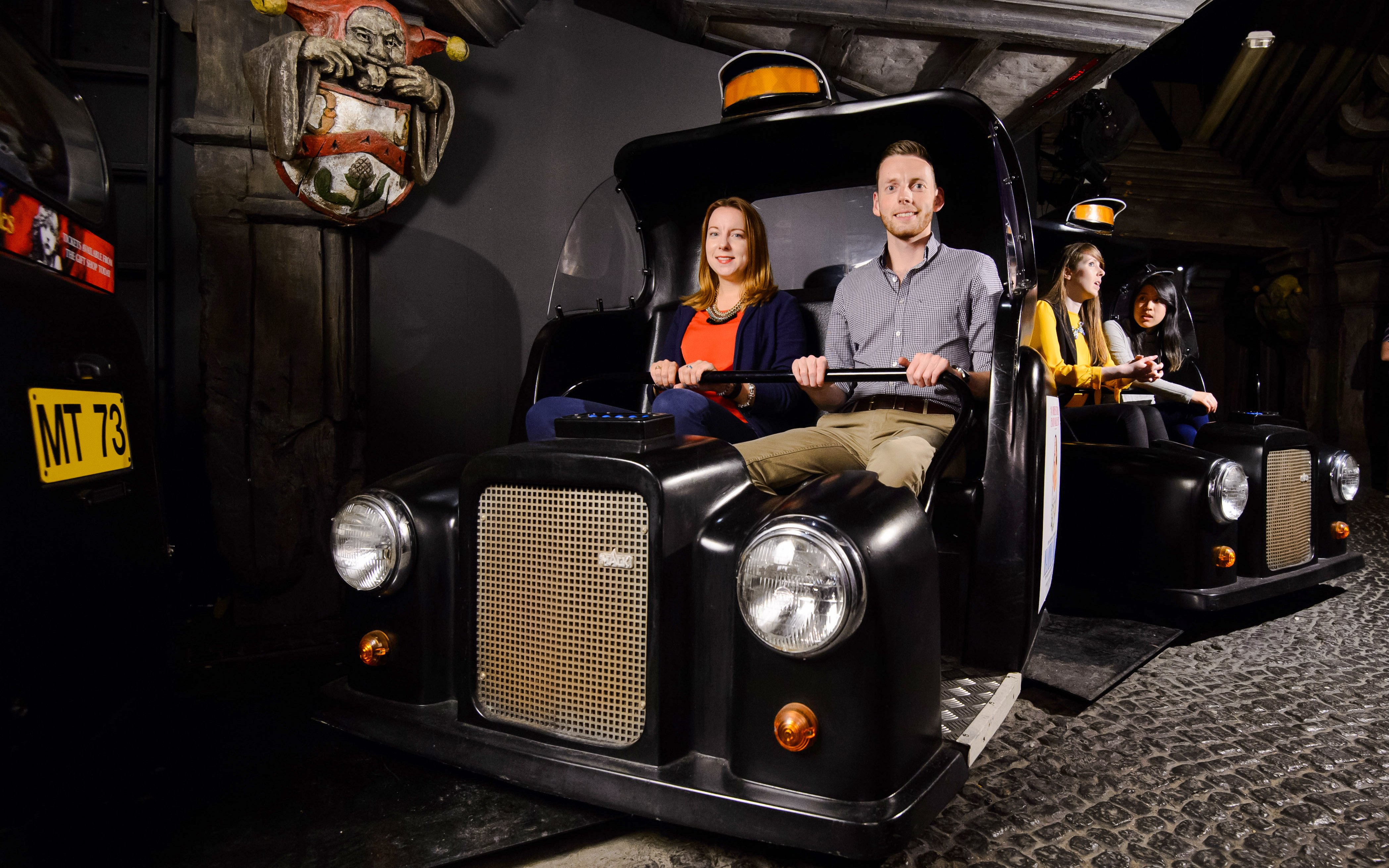 Visitors on the Spirit of London ride at Madame Tussauds London.