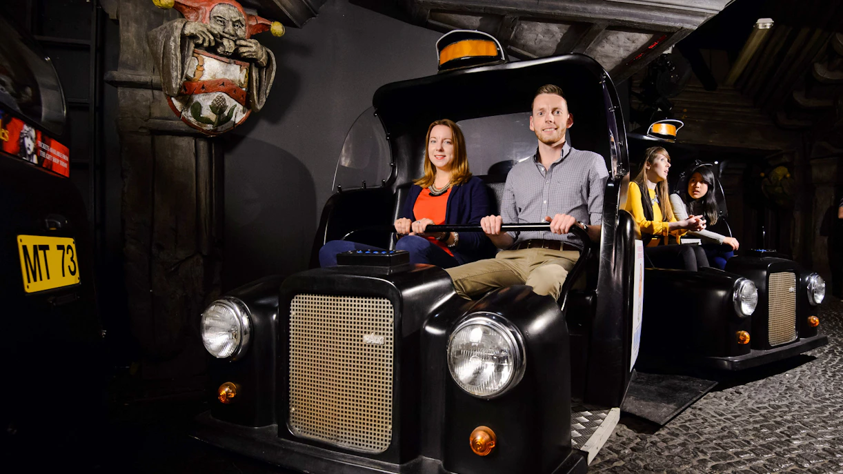 Visitors on the Spirit of London ride at Madame Tussauds London.