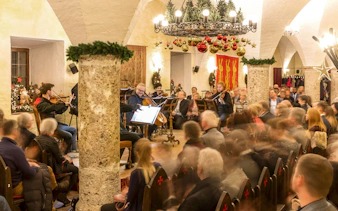 Musicians performing at Fortress Hohensalzburg Christmas Advent concert with audience seated.