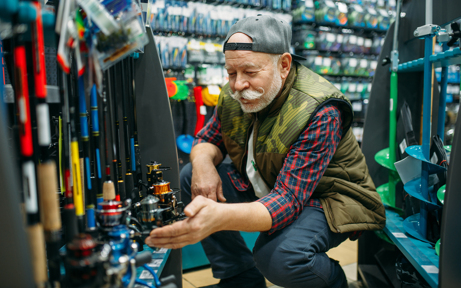 man buying fishing equipment
