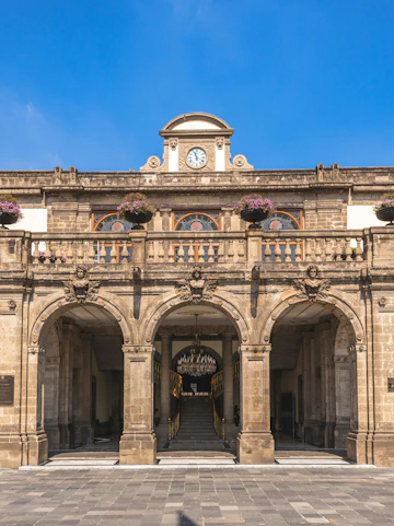 Chapultepec Castle entrance with clock and arches, Mexico City.