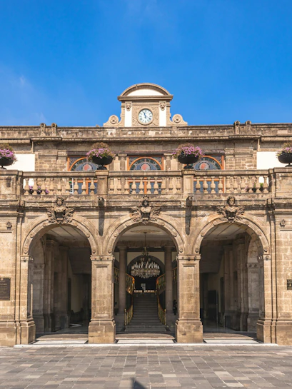 Chapultepec Castle entrance with clock and arches, Mexico City.
