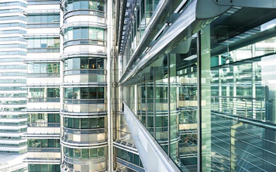 Skybridge exterior of Petronas Twin Towers, Kuala Lumpur, with glass and steel architecture.