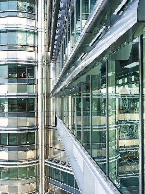 Skybridge exterior of Petronas Twin Towers, Kuala Lumpur, with glass and steel architecture.