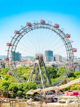 Ferris Wheel Riesenrad in Prater, Vienna with cityscape background.