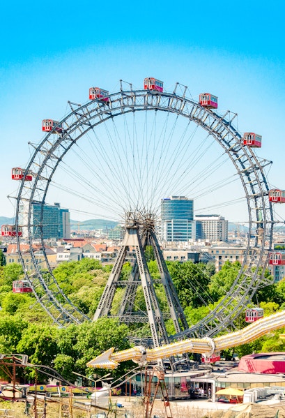 Ferris Wheel Riesenrad in Prater, Vienna with cityscape background.