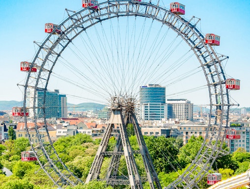 Ferris Wheel Riesenrad in Prater, Vienna with cityscape background.