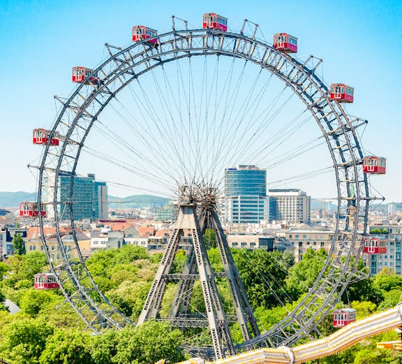 Ferris Wheel Riesenrad in Prater, Vienna with cityscape background.