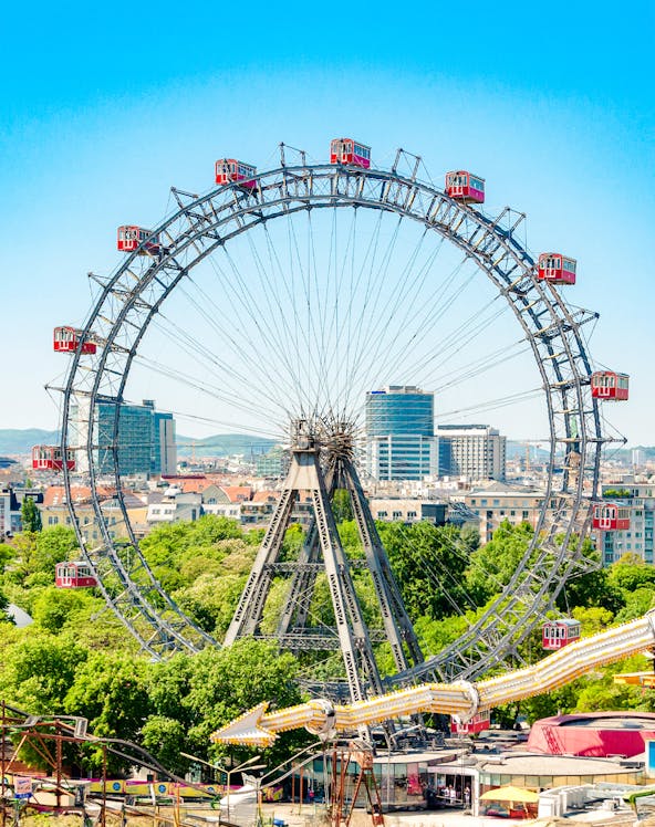 Ferris Wheel Riesenrad in Prater, Vienna with cityscape background.