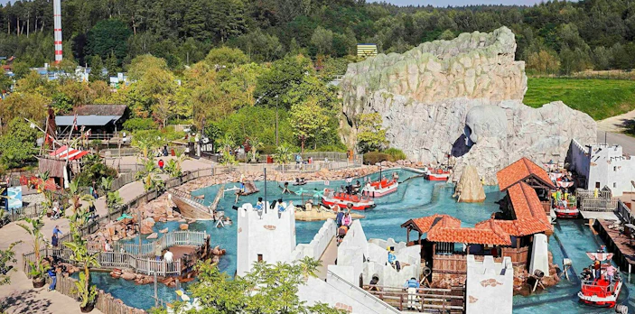 Pirate-themed water ride at Pirate Land, LEGOLAND® Billund with boats and castle structures.