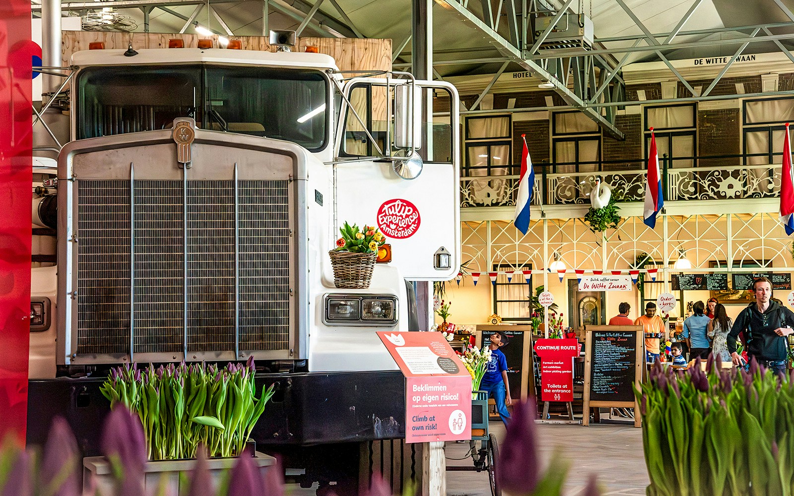 Truck display with tulips inside Keukenhof exhibition hall, Netherlands.
