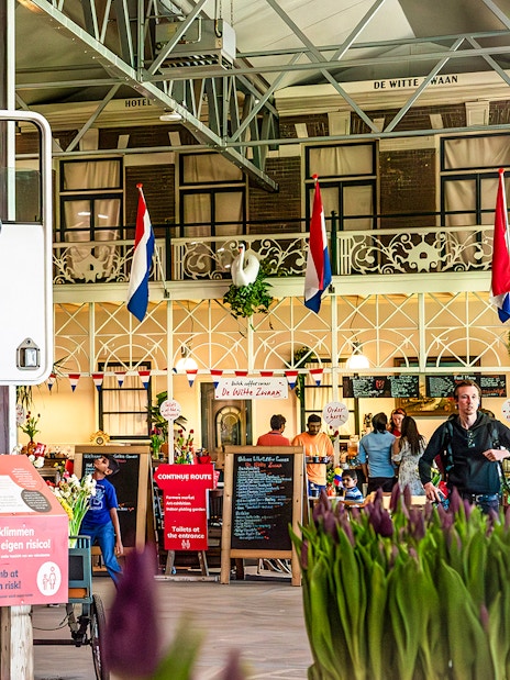 Truck display with tulips inside Keukenhof exhibition hall, Netherlands.