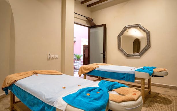 Spa therapy room with massage tables at Traditional Moroccan Steam Hammam, Marrakech.