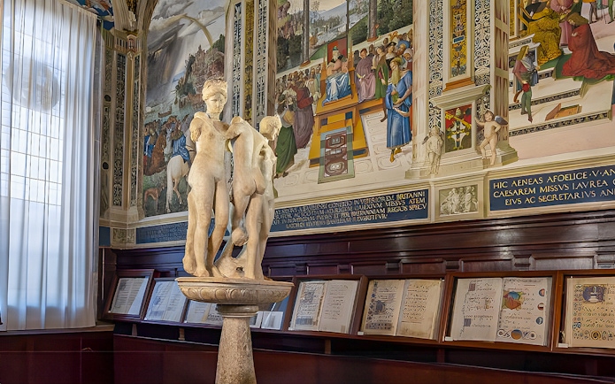 Sculpture and frescoes inside Siena Cathedral library, Italy.