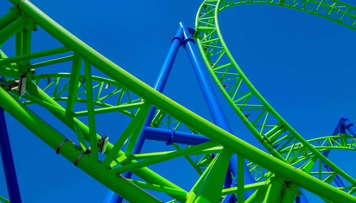 Roller coaster tracks at Seaworld Orlando against a clear blue sky.