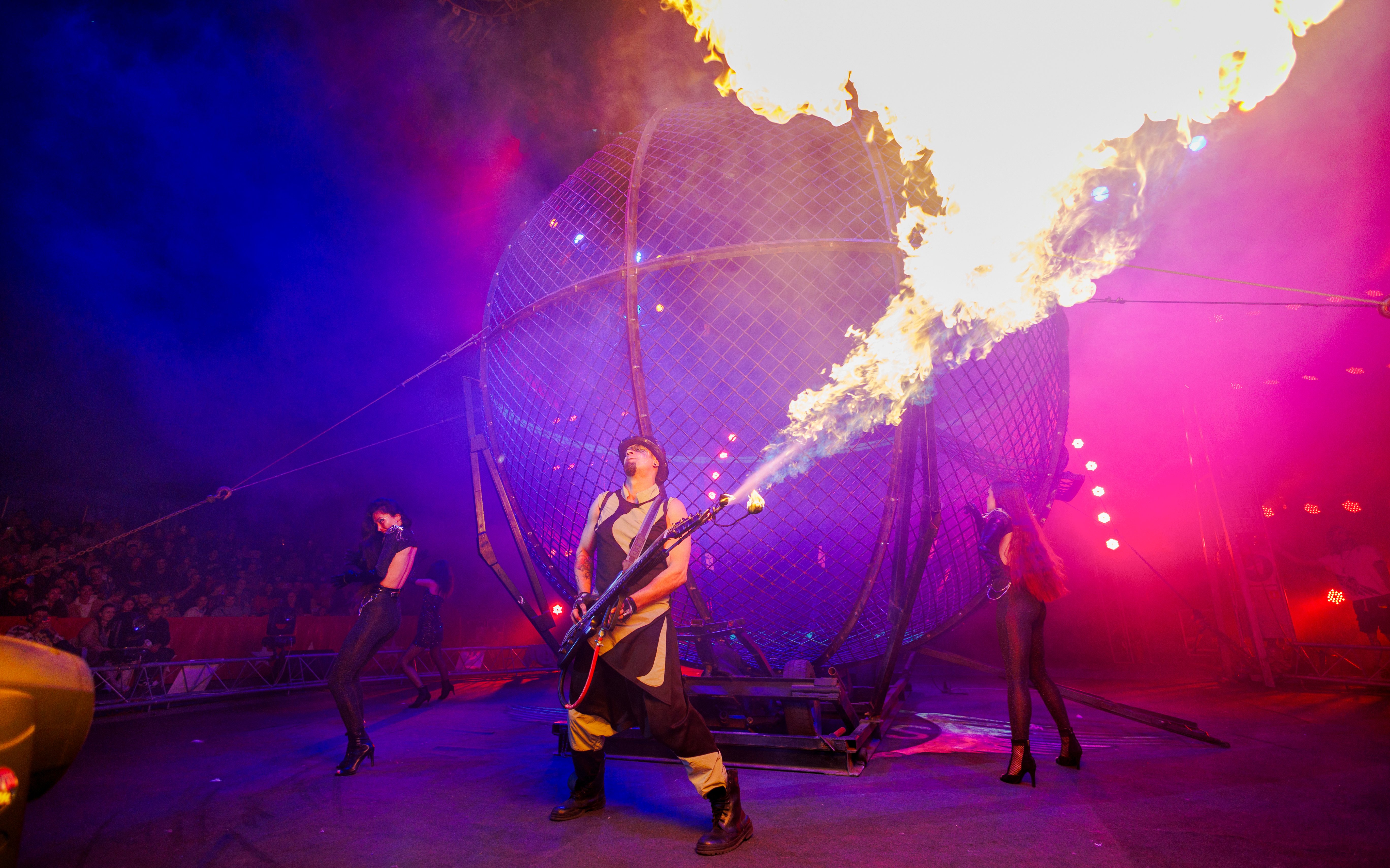 Performer with fire at Aqua Circus Phuket show.