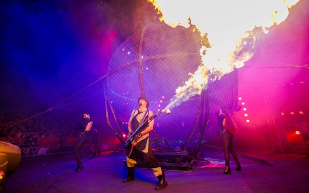 Performer with fire at Aqua Circus Phuket show.