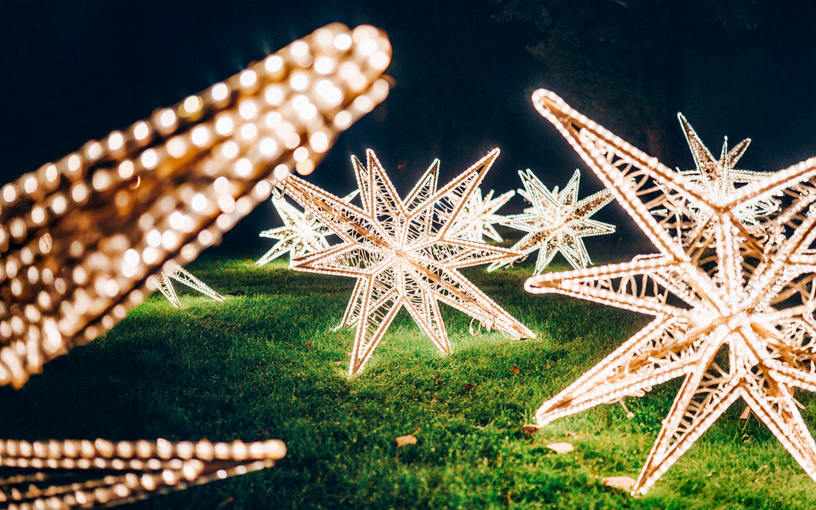 Illuminated star sculptures at Lumina Park, Budapest.