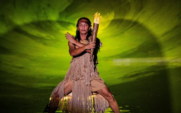 Man holding fire torch at The Legacy of a Generation Show.