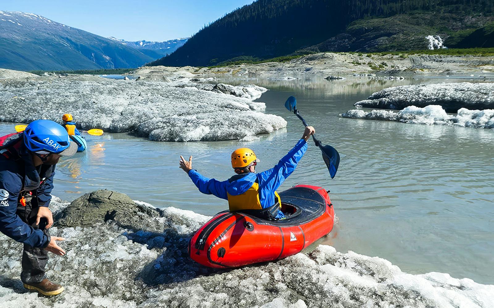 Kayaker launching from icy shore during Norris Adventure tour.