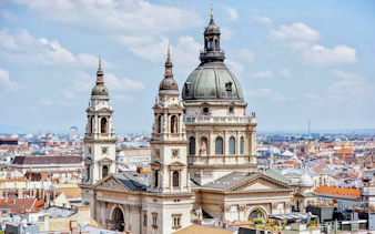 St. Stephen Basilica in Budapest with cityscape in the background.