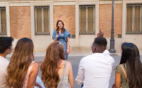 Tour guide speaking to a group during a walking tour in Constanta.