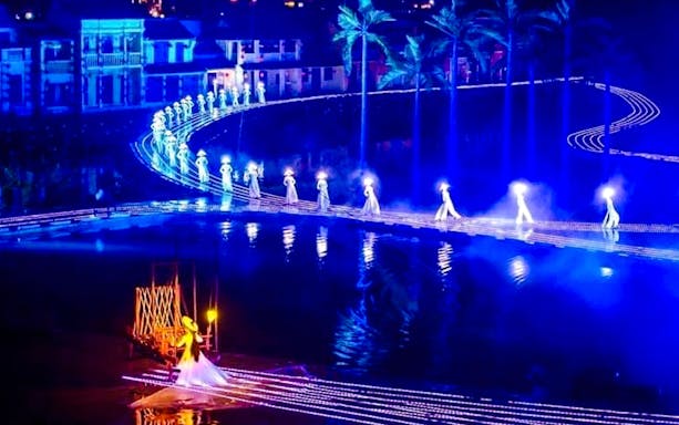 Hoi An Memories Show performers in traditional Vietnamese attire on stage, Hoi An, Vietnam.