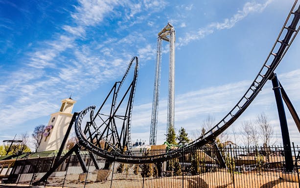 Roller coaster and tower ride at Parque Warner Madrid.