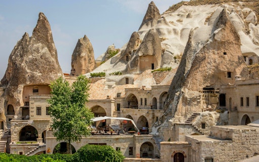 Cave houses in Goreme, Cappadocia, with unique rock formations and stone architecture.