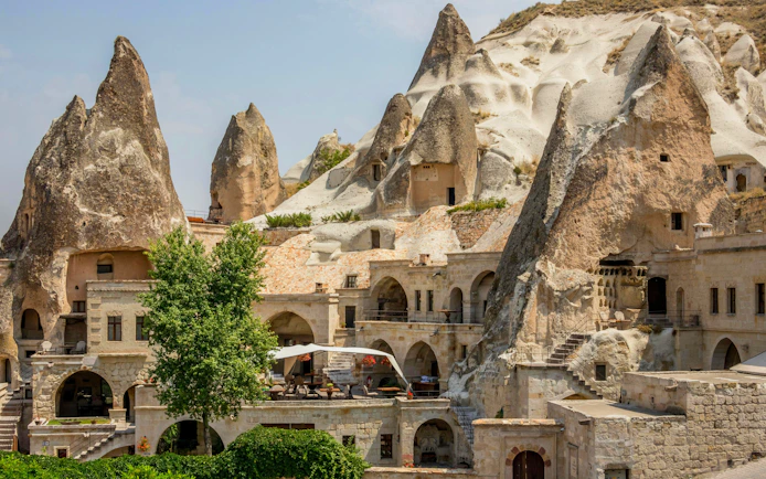 Cave houses in Goreme, Cappadocia, with unique rock formations and stone architecture.