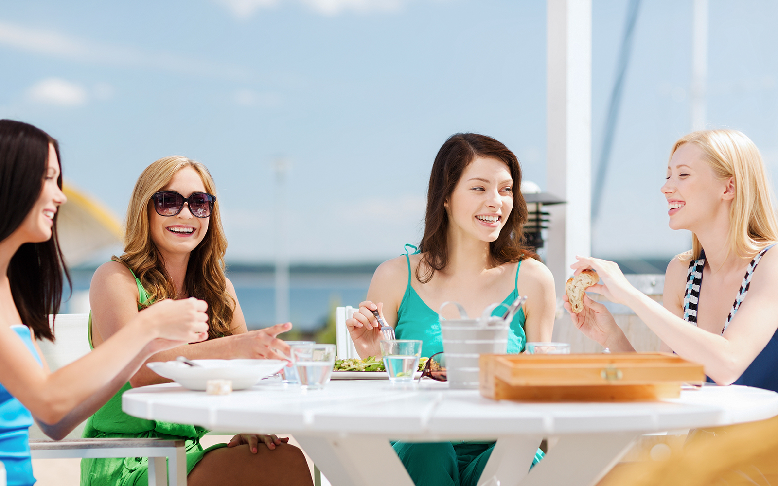 Women enjoying a meal at a cafe.