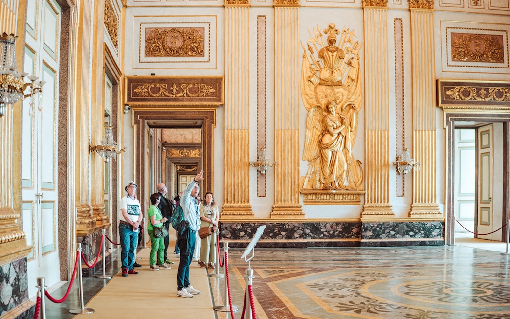Participants on a guided tour inside the ornate Royal Palace of Caserta.