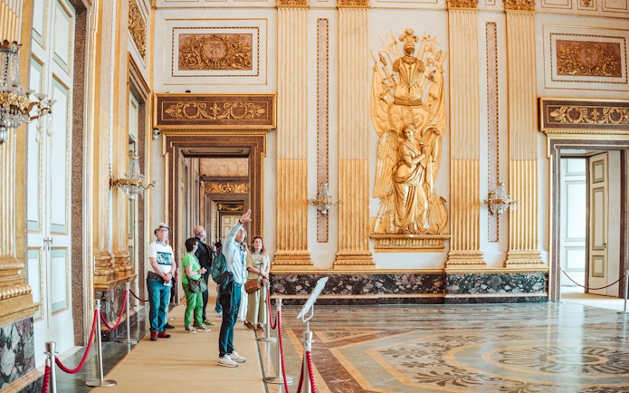 Participants on a guided tour inside the ornate Royal Palace of Caserta.