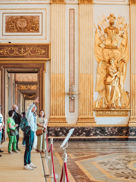 Participants on a guided tour inside the ornate Royal Palace of Caserta.
