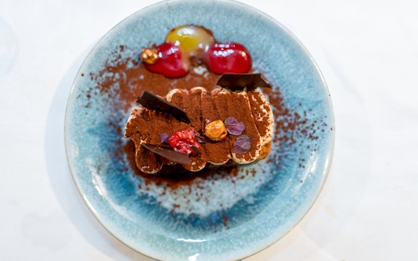 Tiramisu dessert served on Le Diamant Bleu dinner cruise in Paris.