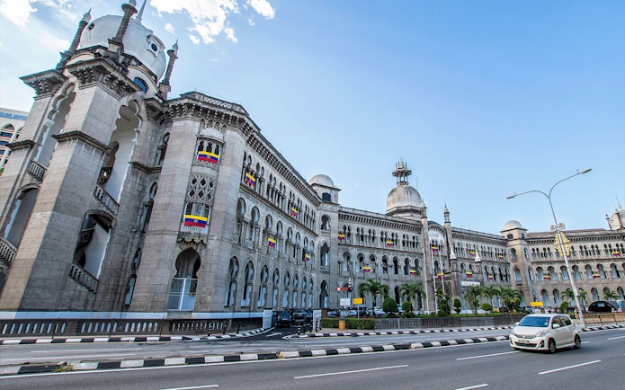 Kuala Lumpur Railway Station with Moorish architecture on a sunny day.