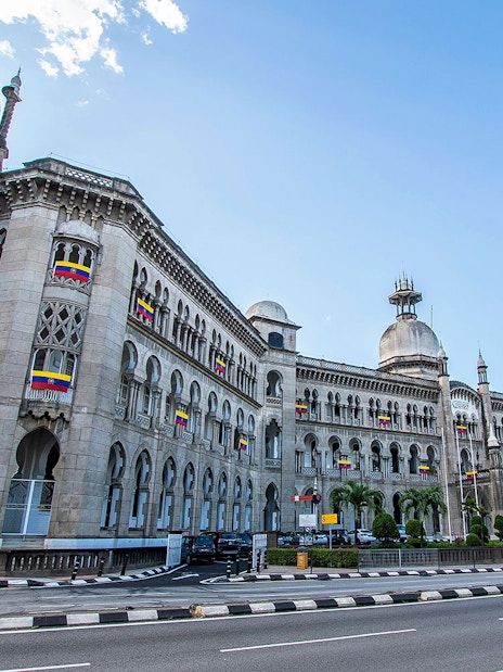 Kuala Lumpur Railway Station with Moorish architecture on a sunny day.