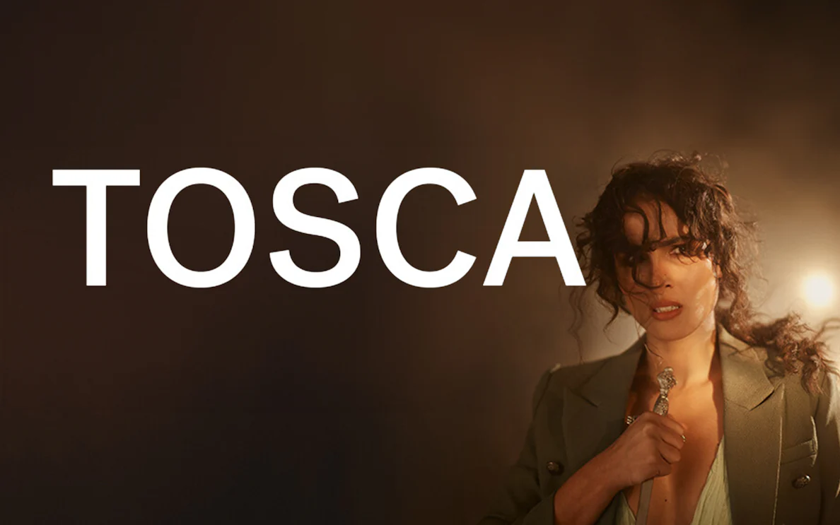 Tosca opera performance with a dramatic scene and a woman holding a dagger.