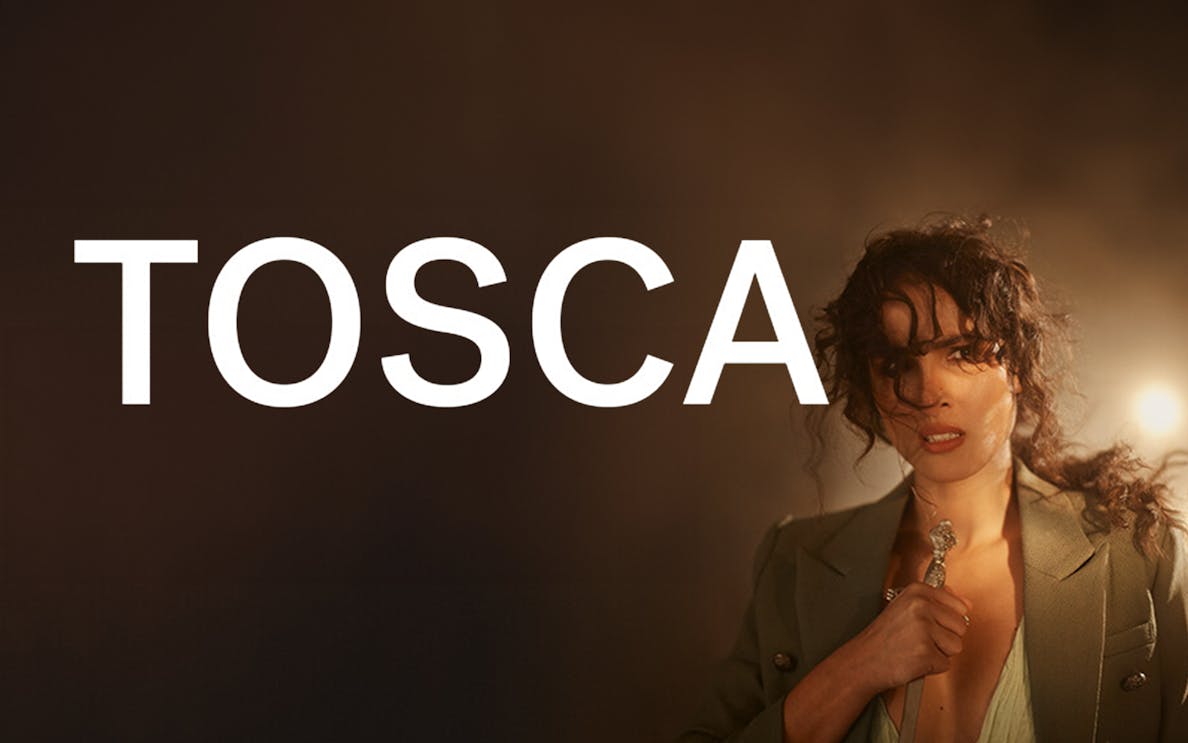 Tosca opera performance with a dramatic scene and a woman holding a dagger.