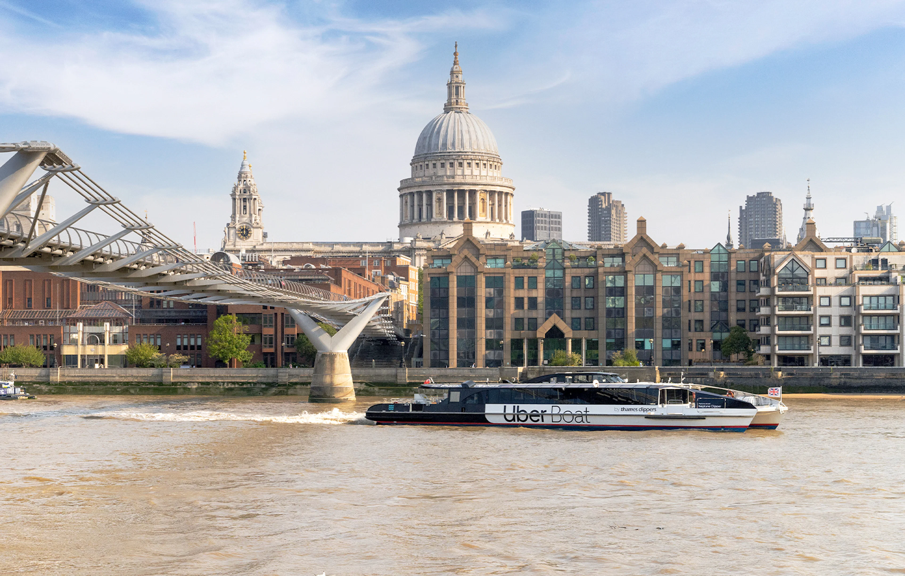 Uber Boat on Thames River near Millennium Bridge, London.